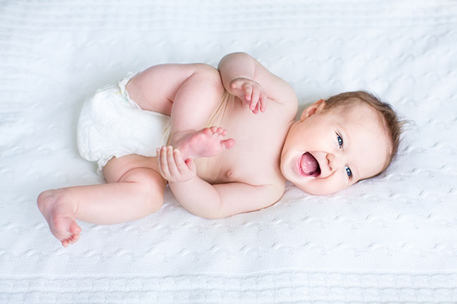 Make Babies Laugh - Photo Collage - Baby In Bed Laughing