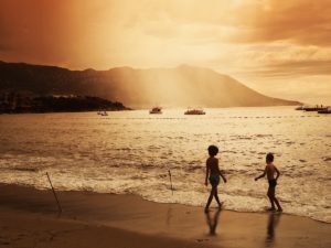 boys playing on beach sunset photography
